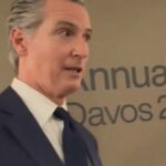 Gavin Newsom speaking at Davos with reporters