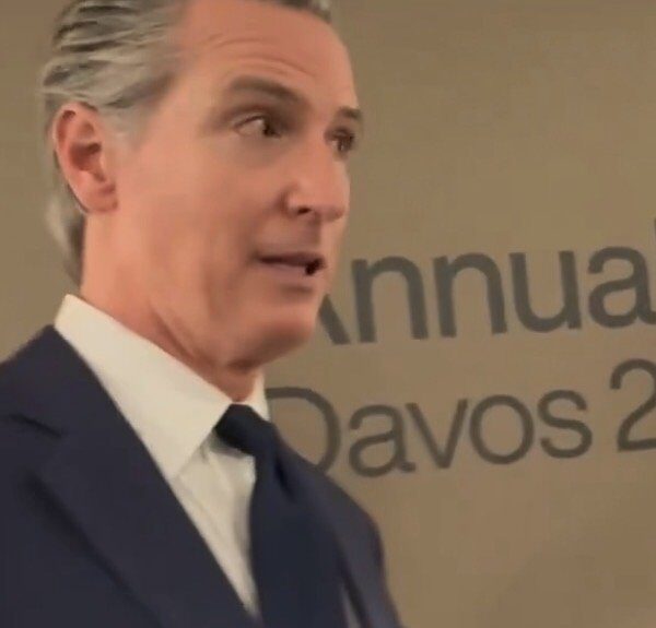 Gavin Newsom speaking at Davos with reporters