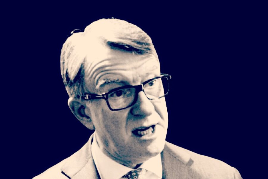 Police officers carrying boxes outside Peter Mandelson's London home during searches